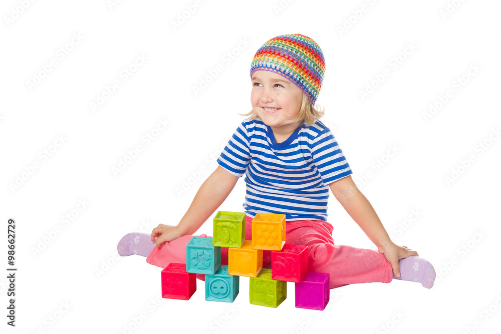 Little girl playing cubes sitting . Little girl playing cubes sitting .
