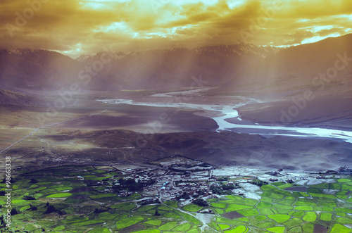 aerial view of ladakh landscape, green valley field on cloudy an