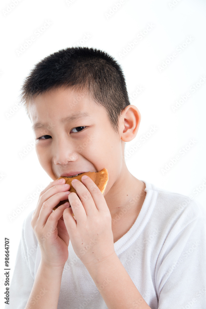 Boy eating dough nut Isolate on white background Boy eating dough nut Isolate on white background