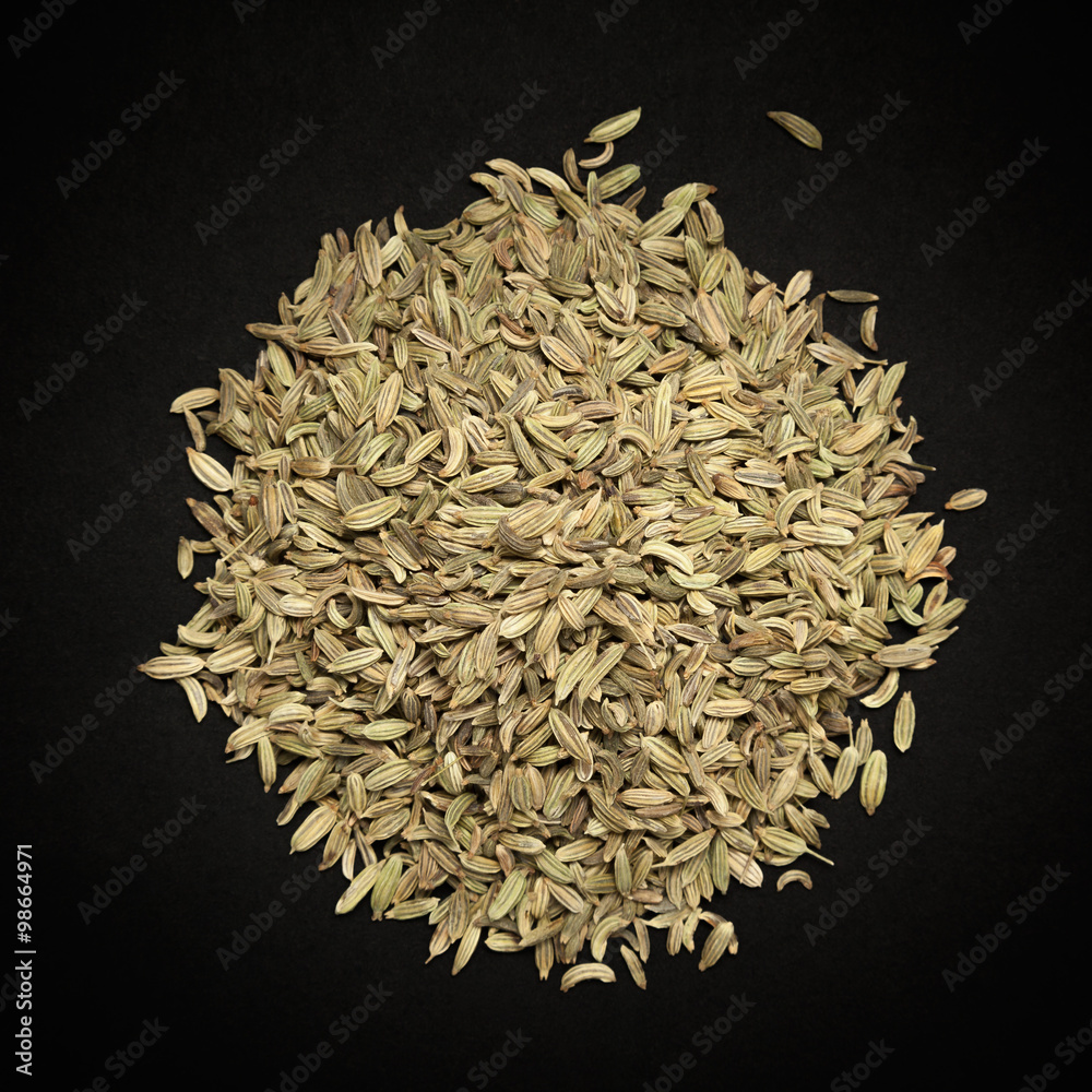 Top view of Organic Fennel seed (Foeniculum Vulgare) isolated on dark background.