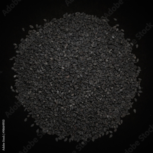 Top view of Organic Black Sesame (Sesamum indicum) isolated on dark background.