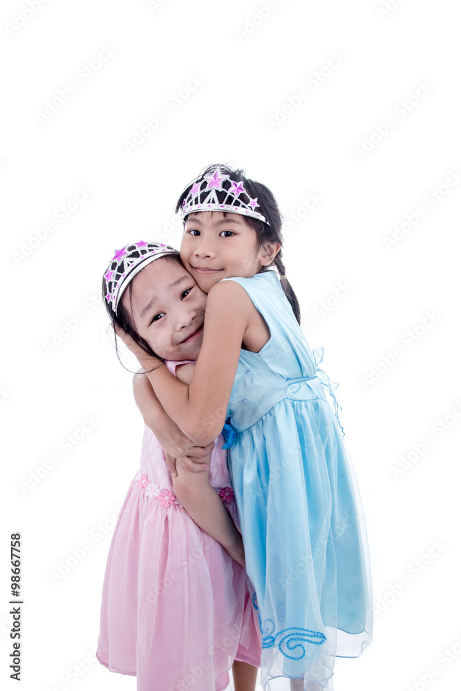 Cute two Asian little princess girls in silver crown and dress h Cute two Asian little princess girls in silver crown and dress h