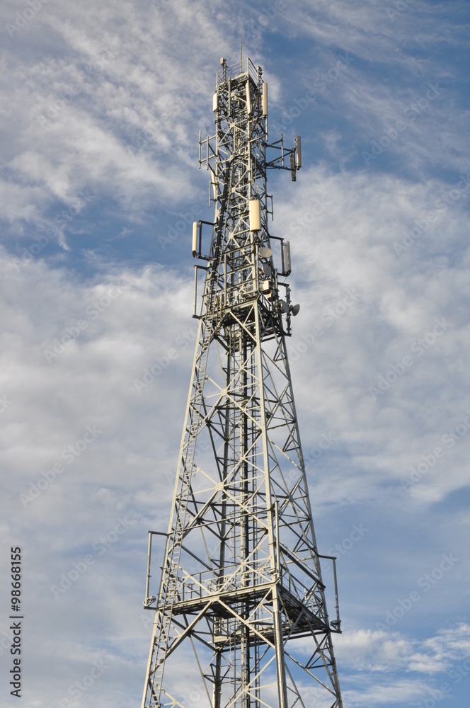 Telecommunication tower against cloudy sky Telecommunication tower against cloudy sky