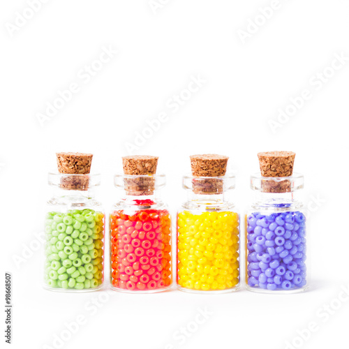 Colorful beads in the bottles
