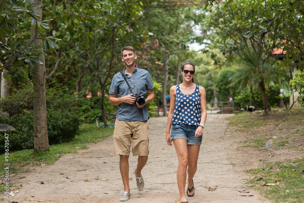 Young tourist couple travel holiday and photographing camera Young tourist couple travel holiday and photographing camera