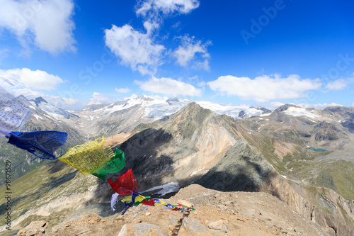 Mountain glacier panorama with summit Großvenediger and Prayer flag in the Hohe Tauern Alps, Austria