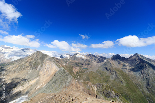 Panorama with lake Eissee, mountain Weißspitze and glacier Großvenediger in the Hohe Tauern Alps, Austria photo