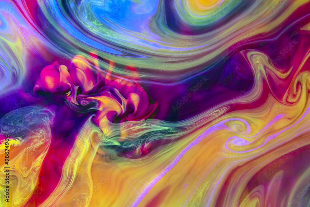 Abstract artistic background. Colors in water create psychedelic colorful organic shapes and structures that reveal themselves when closely observing the image.