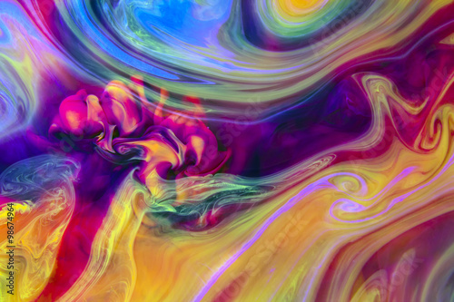 Abstract artistic background. Colors in water create psychedelic colorful organic shapes and structures that reveal themselves when closely observing the image.