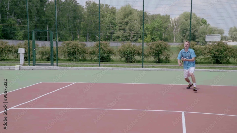 Powerful forehand in jump. Spectacular tennis shot in slow motion.The player shows his tennis skills. This session is full of many different extremely good shots Powerful forehand in jump. Spectacular tennis shot in slow motion.The player shows his tennis skills. This session is full of many different extremely good shots