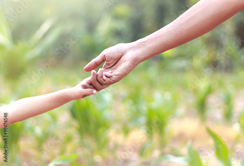 Father and child holding hands - Helping concept