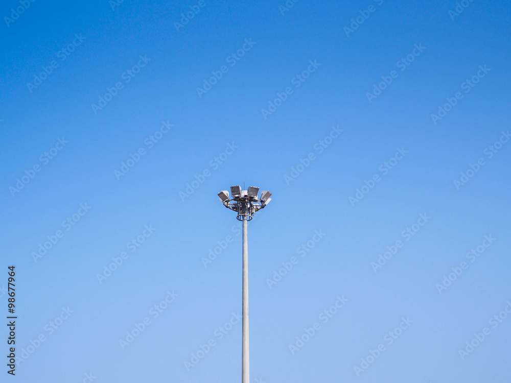 Light pole tower on clear blue sky. Light pole tower on clear blue sky.