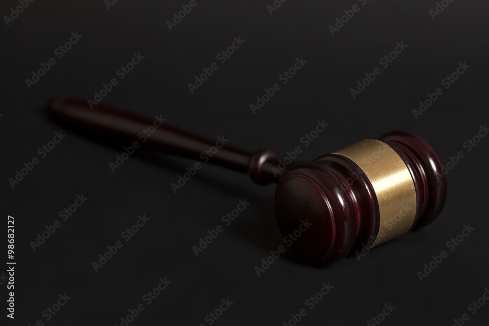 Judge's gavel on black background