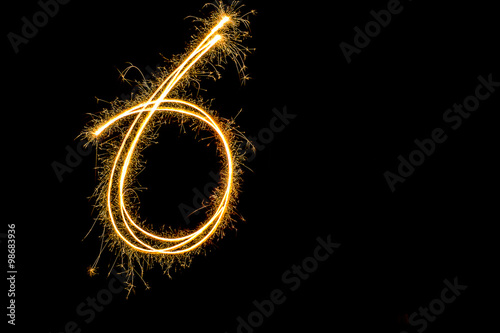 sparkler firework letter 6 isolated on black background 