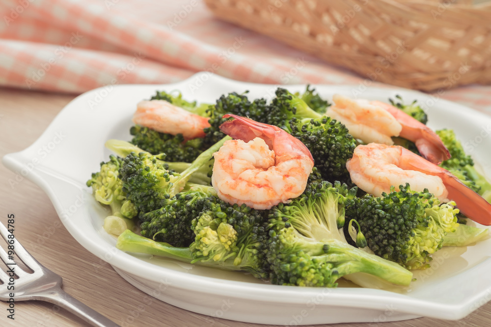 Stir fried broccoli with shrimp on plate Stir fried broccoli with shrimp on plate