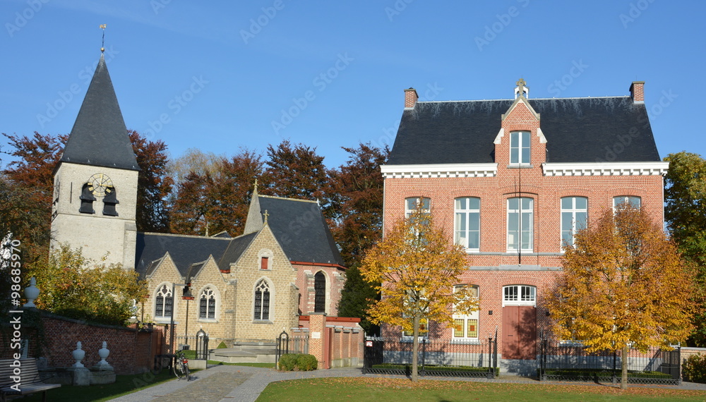 Restorated Lambertus church and vicarage in the village of Gestel, part of Berlaar, near Antwerp, Belgium