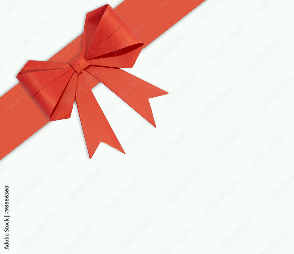 Red ribbon with bow made of paper on a white background Red ribbon with bow made of paper on a white background