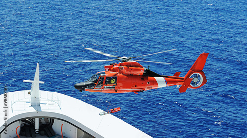 Rescue helicopter next to ship