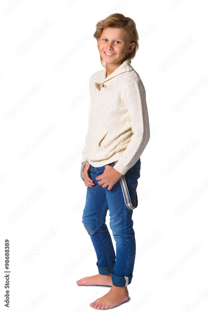 Fototapeta premium Cute blonde boy or teenager in full length casual style blue jeans posing isolated on white