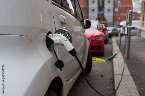 Photography White electric car charging