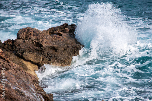 sea waves rolling on stones