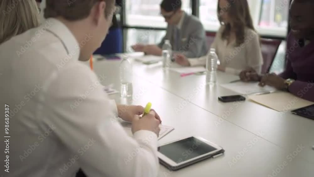 Group of attractive professionals involved in meeting Group of attractive professionals involved in meeting