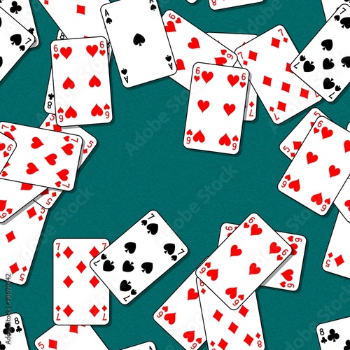 Playing cards scattered on a green table. Seamless pattern texture background. The table in the gaming casino. photo