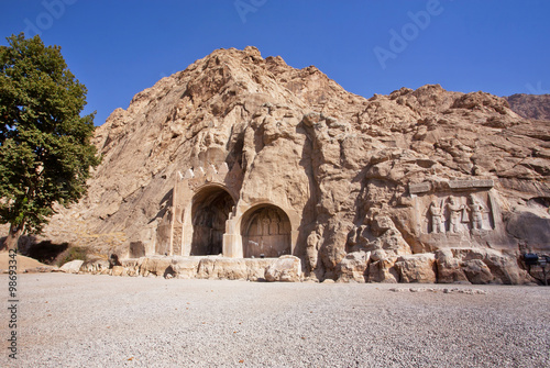 Historical bas-relief in ancient Arches of Taq-e Bostan from the era of Sassanid Empire of Persia.