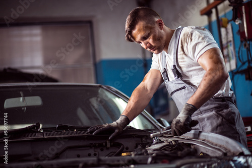 Muscled car mechanic