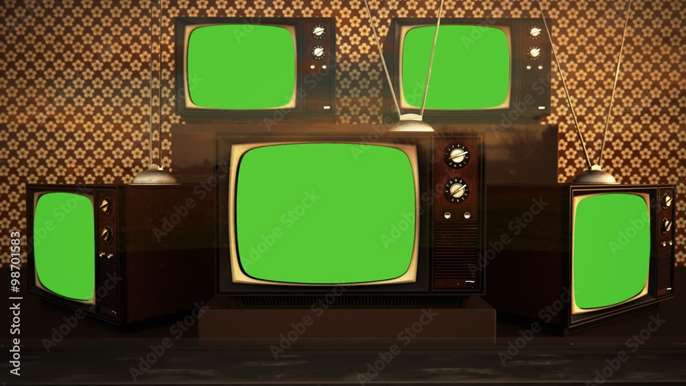 An exhibition of old-fashioned retro color tv sets with tuner antennas.
