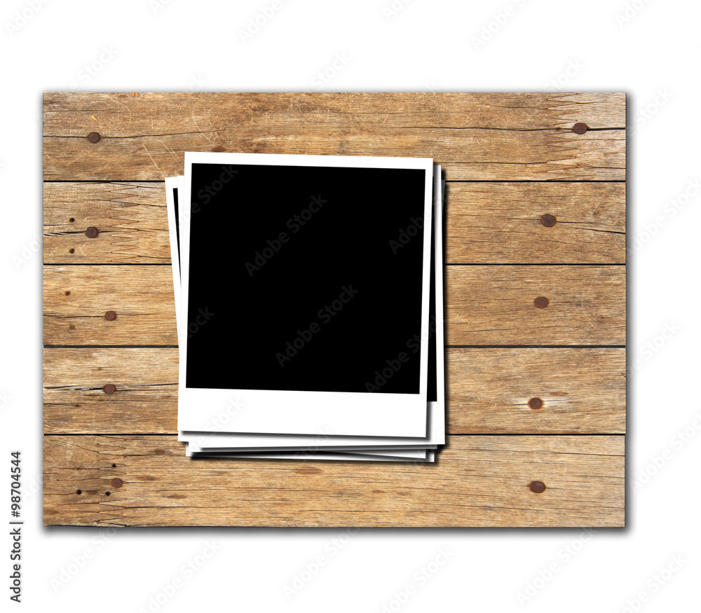 Stock Photo:Polaroid photo frames on old wooden background Stock Photo:Polaroid photo frames on old wooden background
