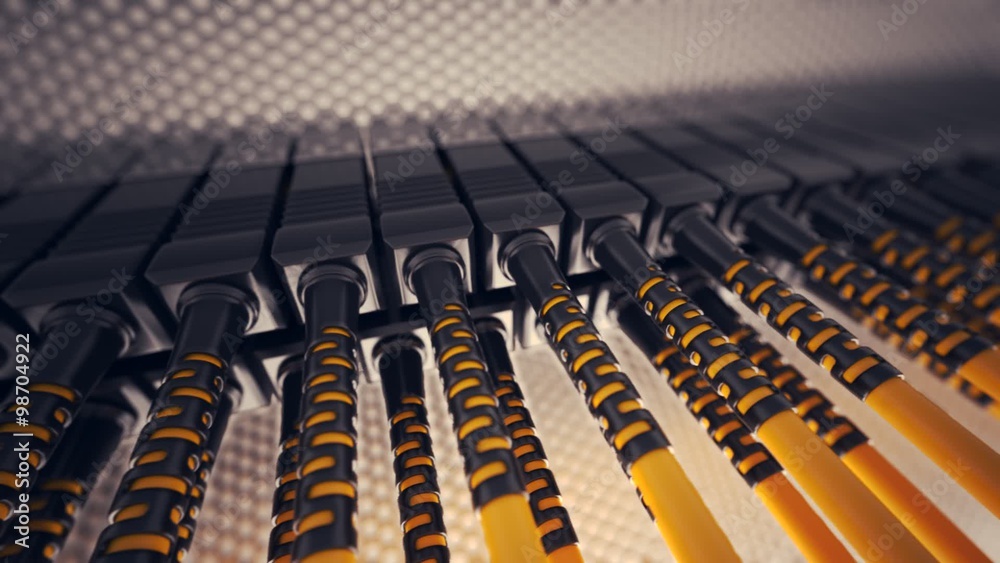 Endless array of orange optic cables connected to the router ports. Loopable. HD Endless array of orange optic cables connected to the router ports. Loopable. HD