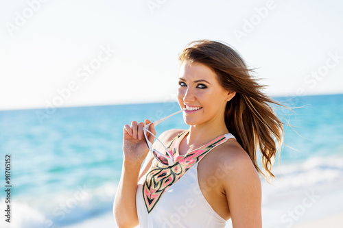 Young woman walking along the beach