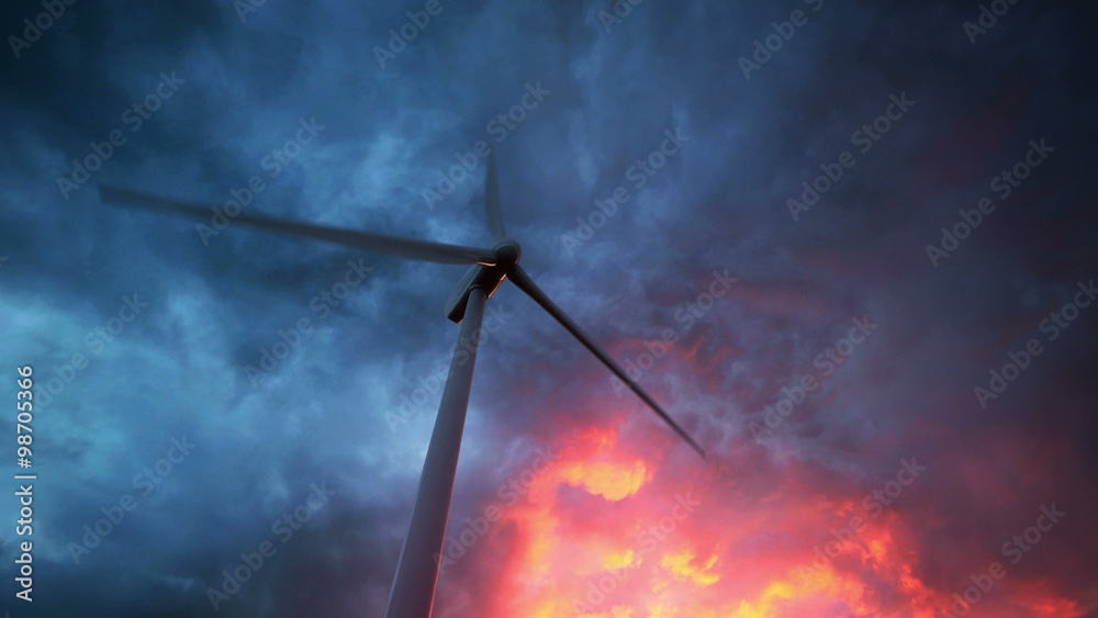 Electricity generating wind turbine spinning around. Loopable animation. HD