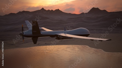 Military predator drone flying at sunset. Intelligent unmanned vehicle.