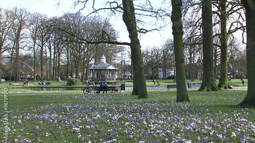 people enjoying spring colors in city park, Oranjepark Apeldoorn, The Netherlands photo