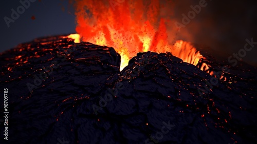 Active volcano eruption. Volcanic crater throws away glowy orange fireballs photo