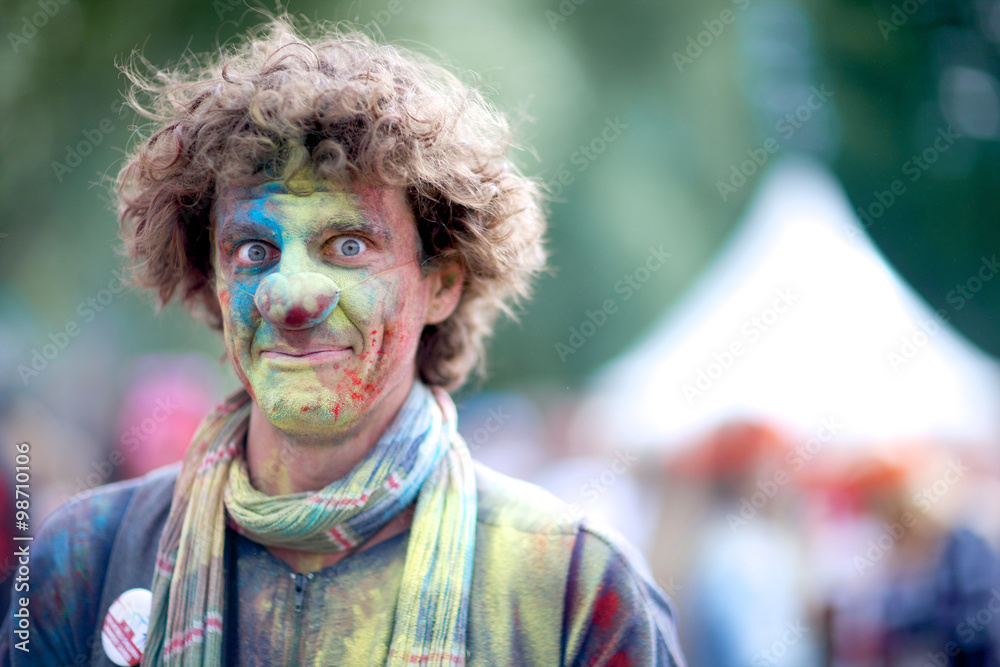 Face of a surprised clown trying not to laugh; celebrating Holi festival Face of a surprised clown trying not to laugh; celebrating Holi festival