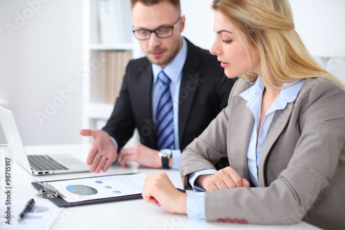 Two successful business partners working at meeting in office