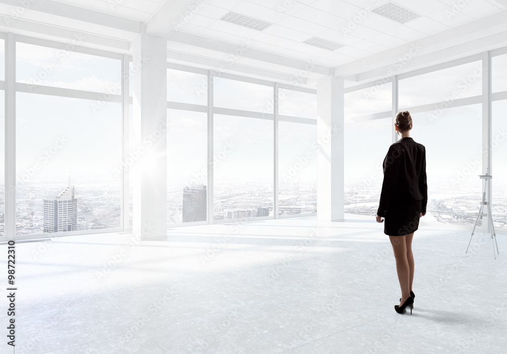 Businesswoman in top floor office