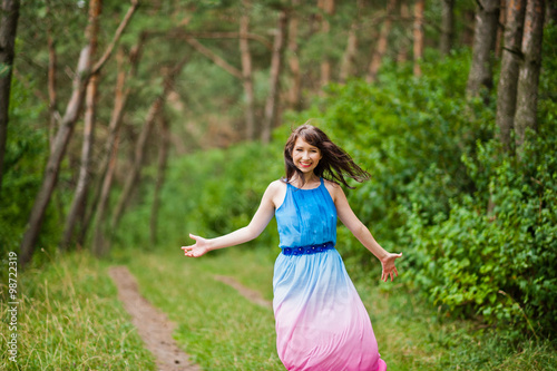 Young beautiful and cute girl posed at pine forest