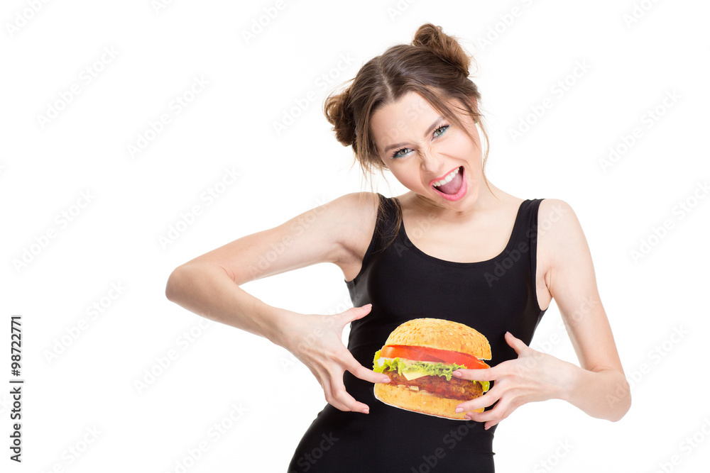 Woman in top with hamburger print joking and touching belly Woman in top with hamburger print joking and touching belly