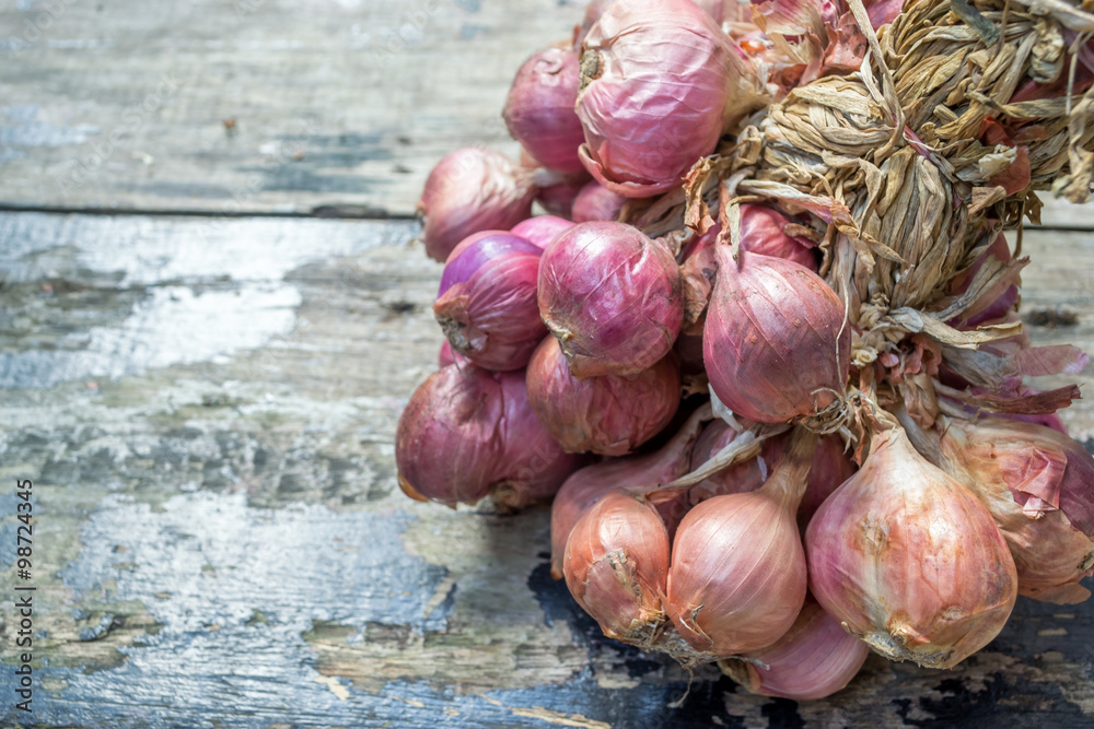 shallots on old wooden background