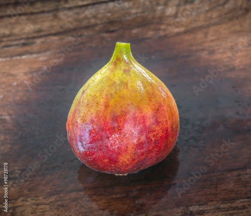 ripe brown turkey figs on teak wooden