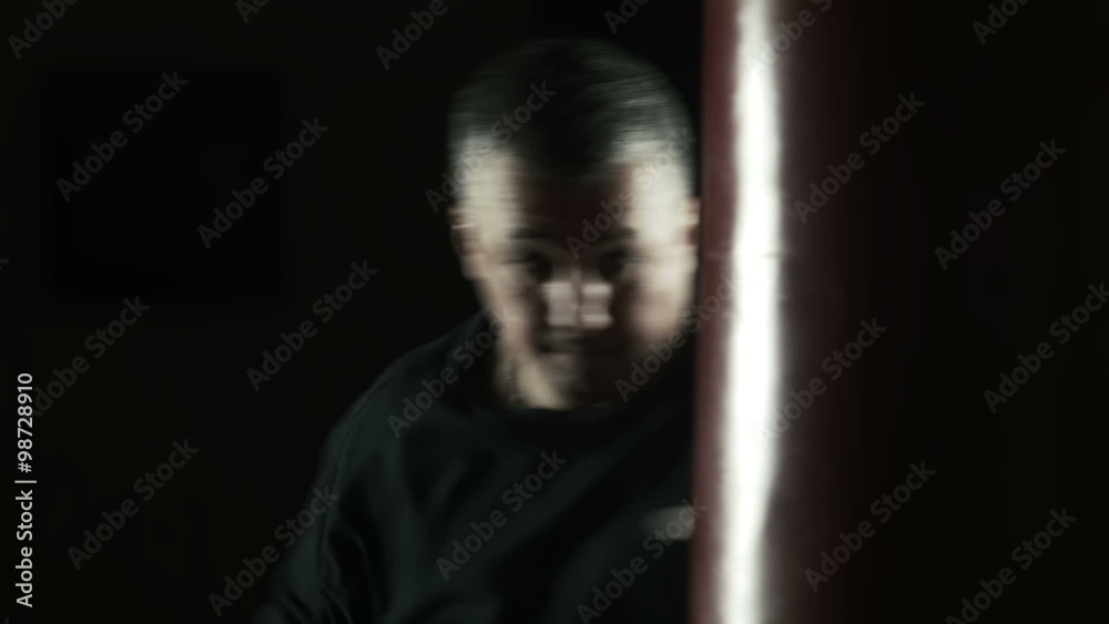 silhouette of boxer hitting the punching bag silhouette of boxer hitting the punching bag