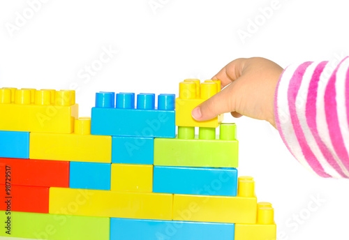 hand stack up Bricks set as a wall on white background
