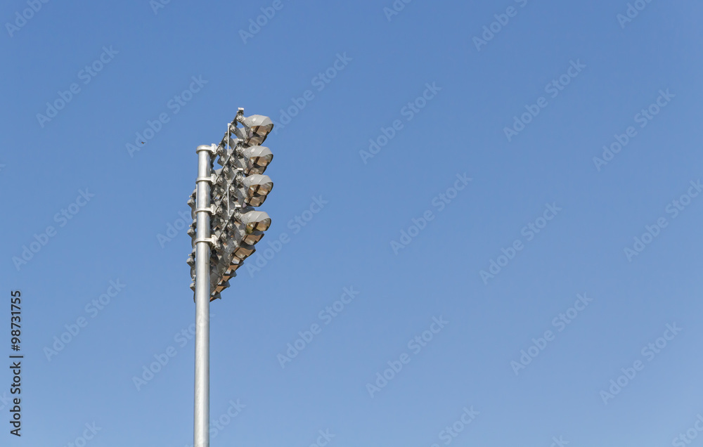 Fototapeta premium Spotlights soccer stadium with blue sky