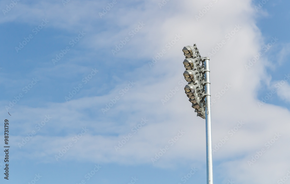 Fototapeta premium Spotlights soccer stadium with blue sky