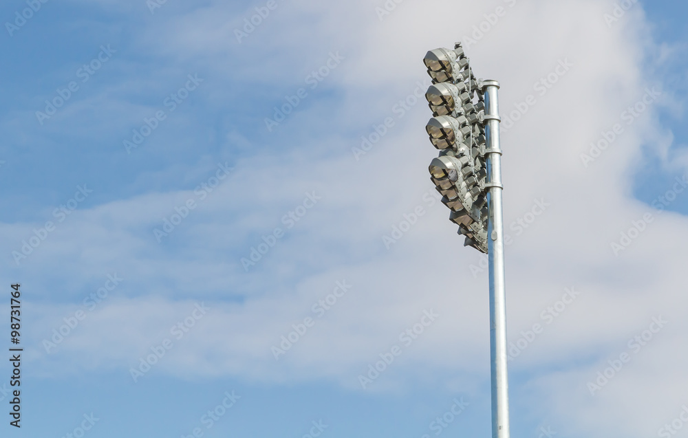 Obraz premium Spotlights soccer stadium with blue sky