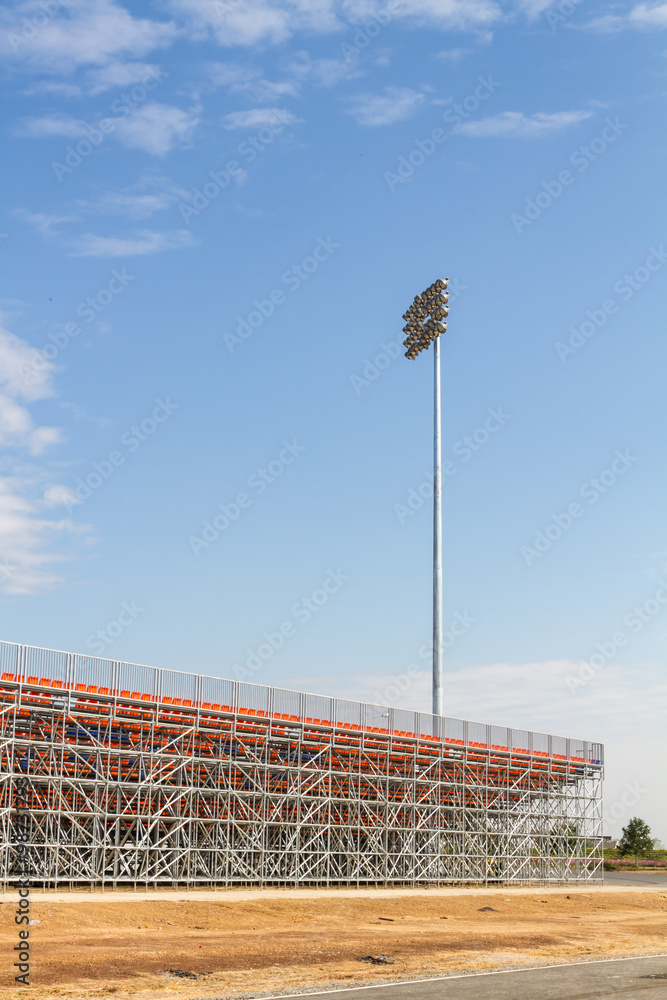Fototapeta premium Spotlights soccer stadium with blue sky